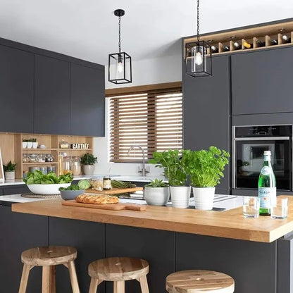 Black pendant lamp with open frame and inner glass cylinder