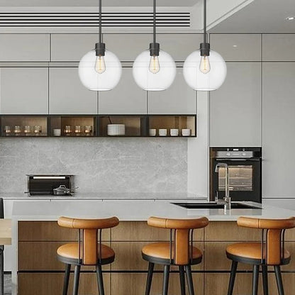 Black pendant lamp with spherical clear glass shade