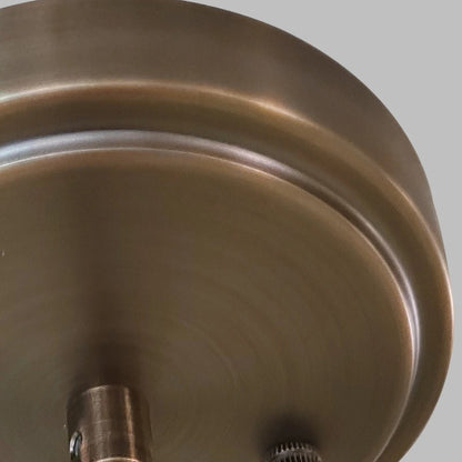 Brass pendant lamp with clear cylindrical glass shade