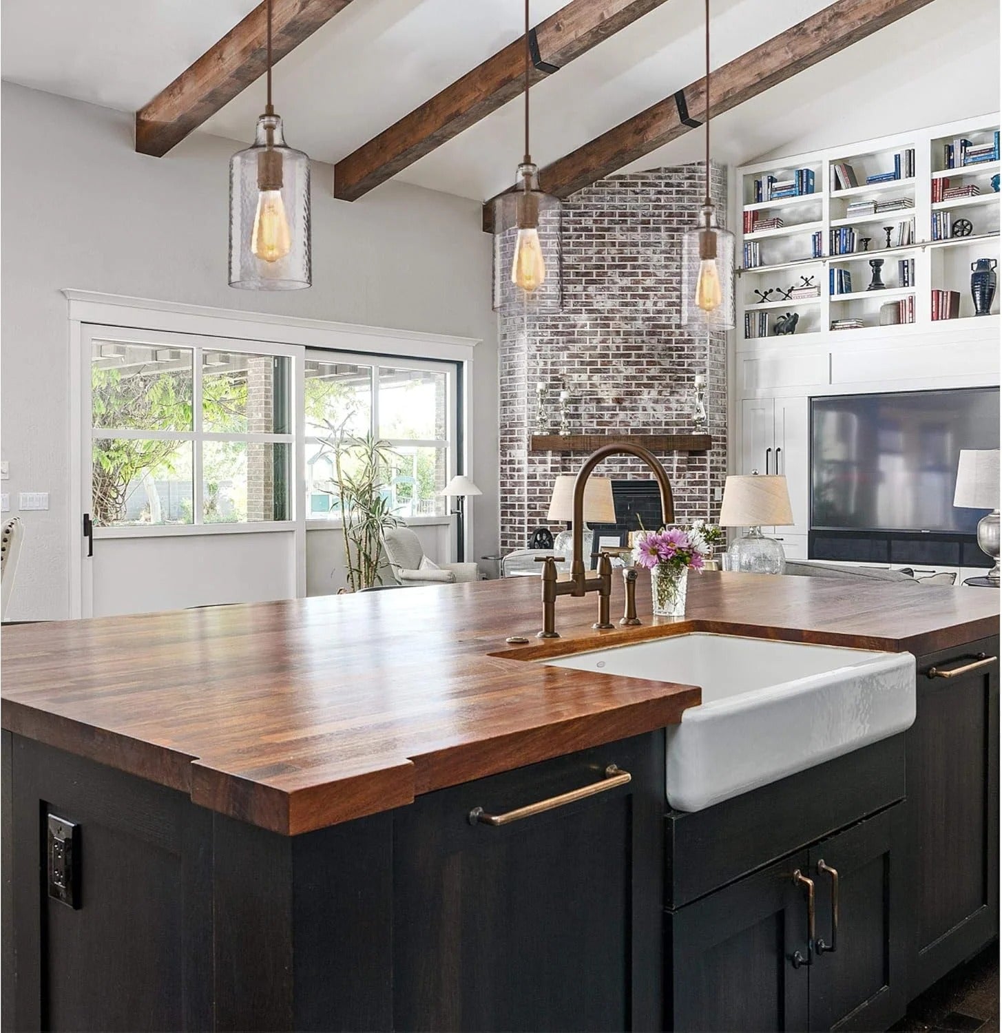Brass pendant lamp with clear cylindrical glass shade