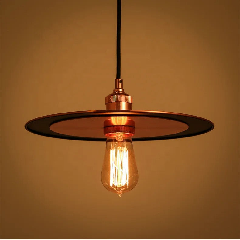 Copper-colored pendant lamp with flat disc detail and exposed bulb