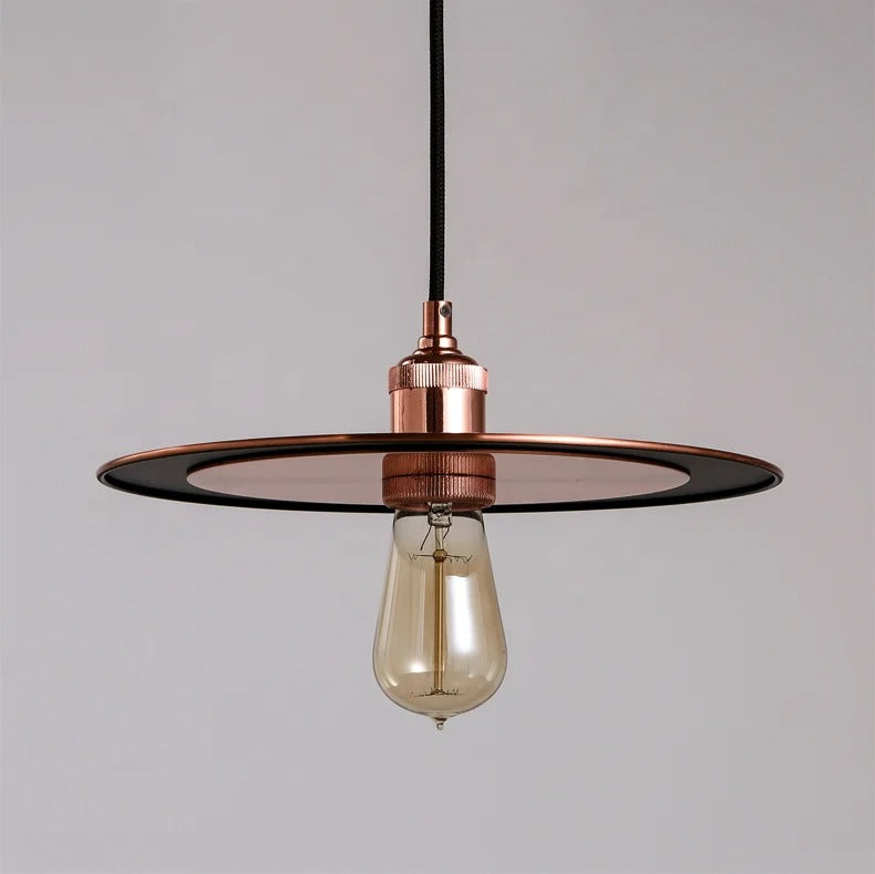 Copper-colored pendant lamp with flat disc detail and exposed bulb