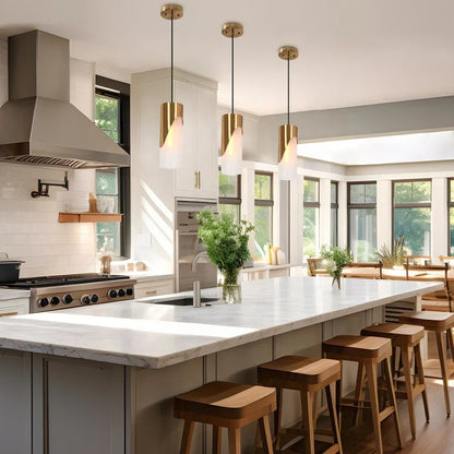 Gold-colored pendant lamp with cylindrical glass shade