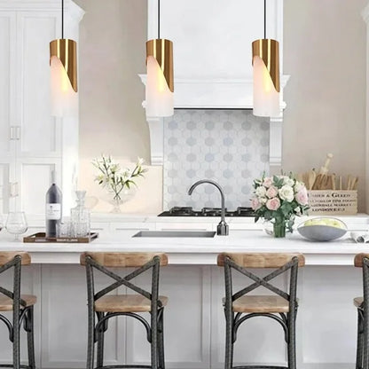 Gold-colored pendant lamp with cylindrical glass shade