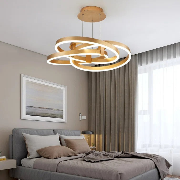 Gold-colored pendant lamp with overlapping circular ring elements