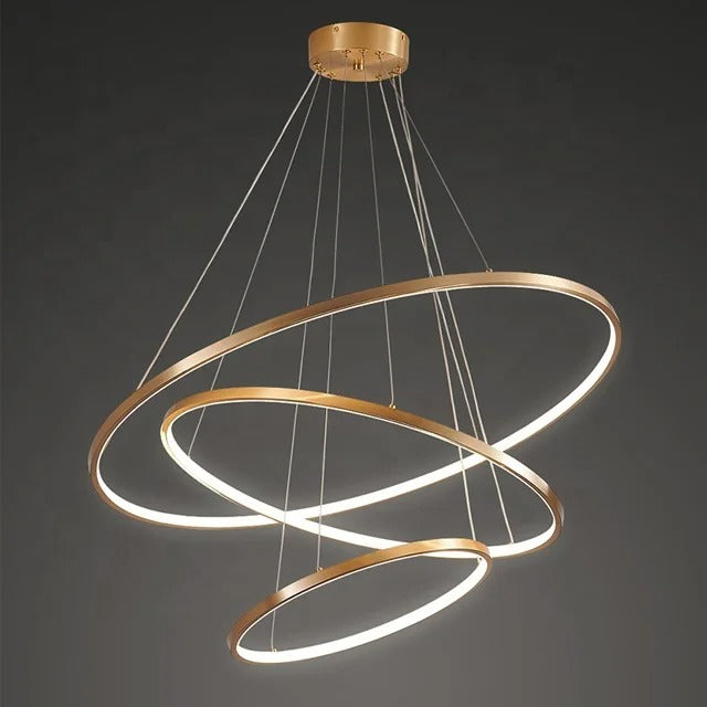Gold-colored pendant lamp with three circular ring elements