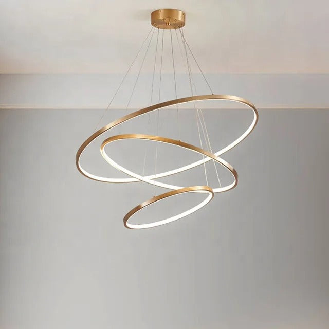 Gold-colored pendant lamp with three circular ring elements