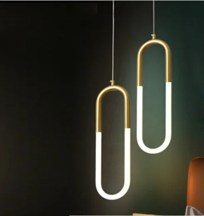 Gold-colored pendant lamp with two U-shaped glass elements